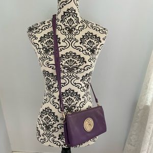 Slim purple vegan crossbody bag with adjustable strap